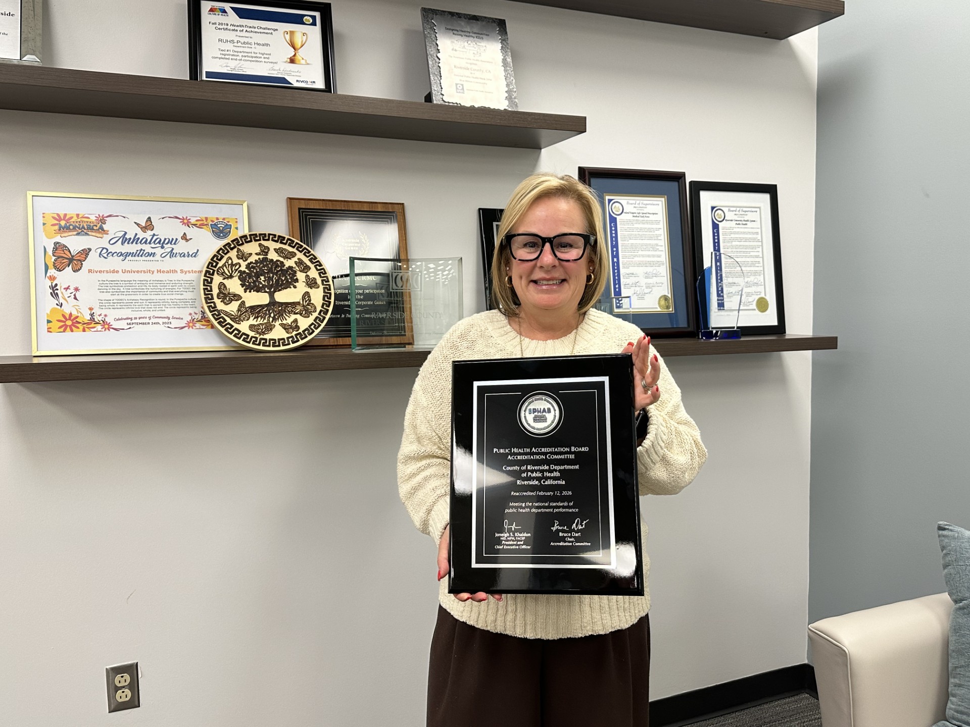 Kim Saruwatari holding PHAB plaque