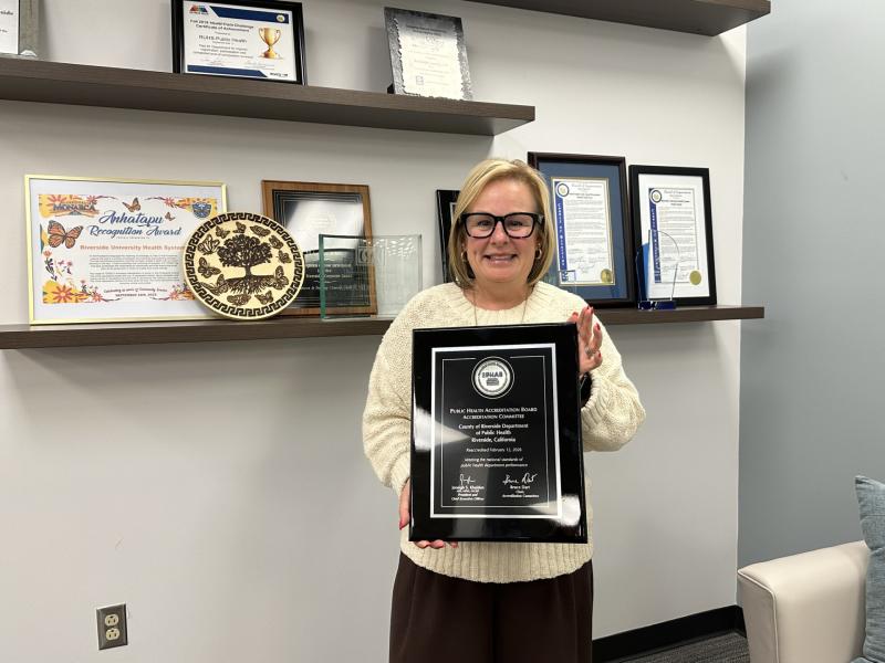 Kim Saruwatari holding PHAB plaque